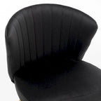 Fauteuil d'appoint moderne en velours avec design capitonné, assise sans accoudoirs confortable et tendance.