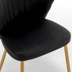 Fauteuil d'appoint moderne en velours avec design capitonné, assise sans accoudoirs confortable et tendance.