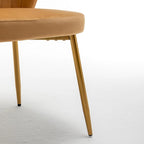 Fauteuil d'appoint moderne en velours avec design capitonné, assise sans accoudoirs confortable et tendance.